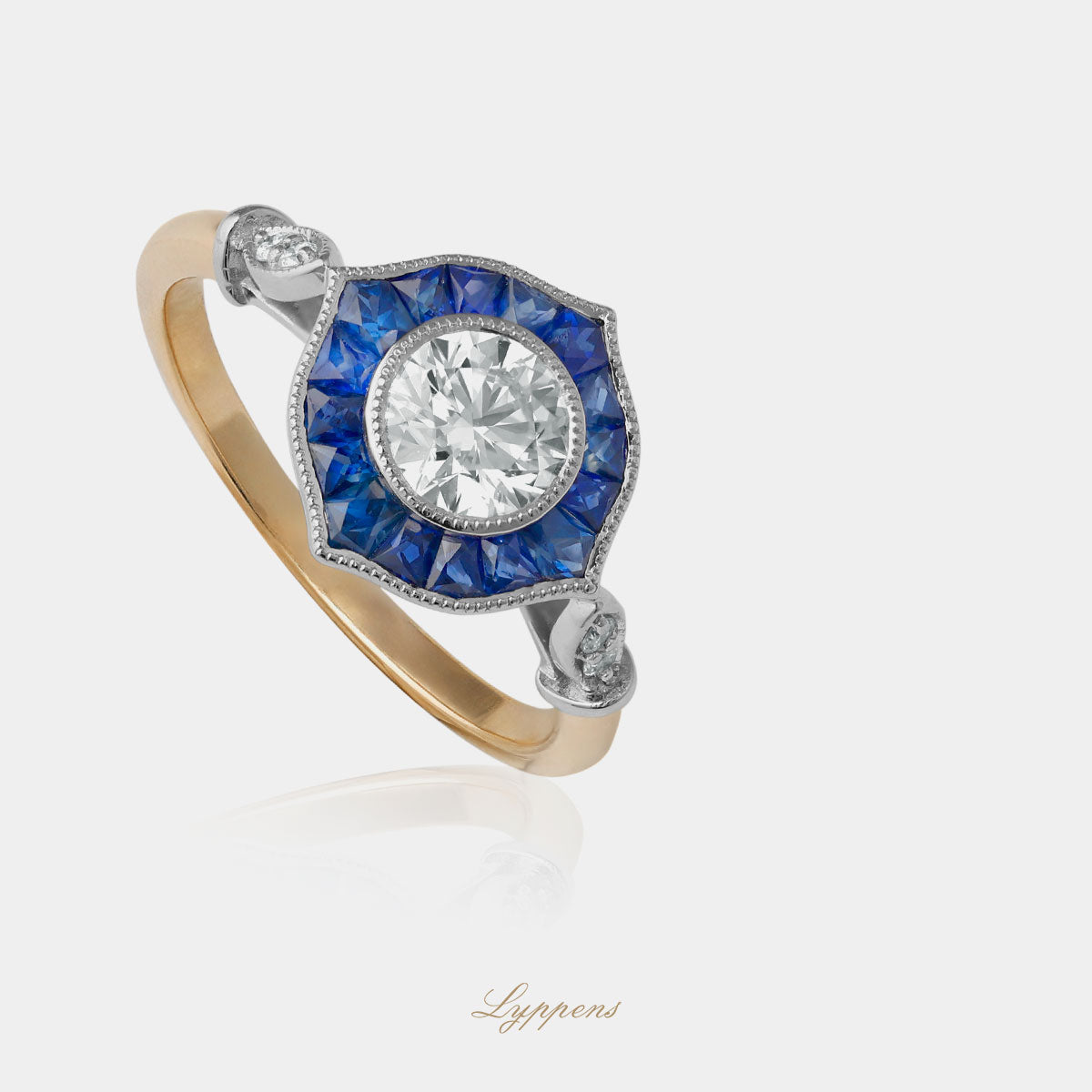Geel- en witgouden ring met diamant en saffieren