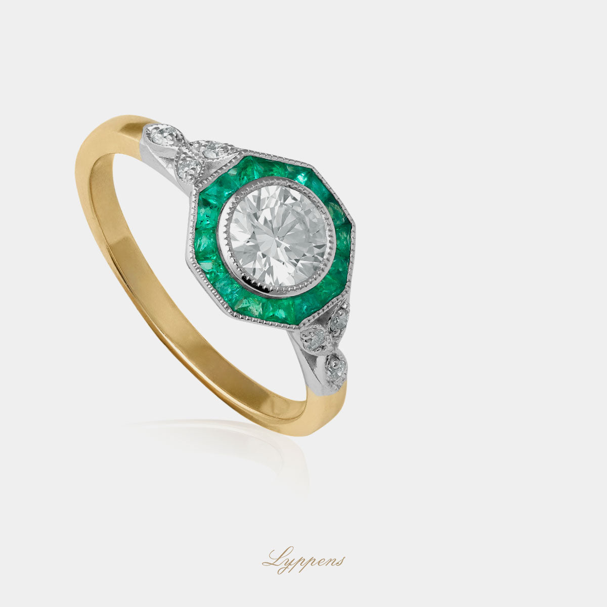 Yellow and white gold ring with emerald and diamonds