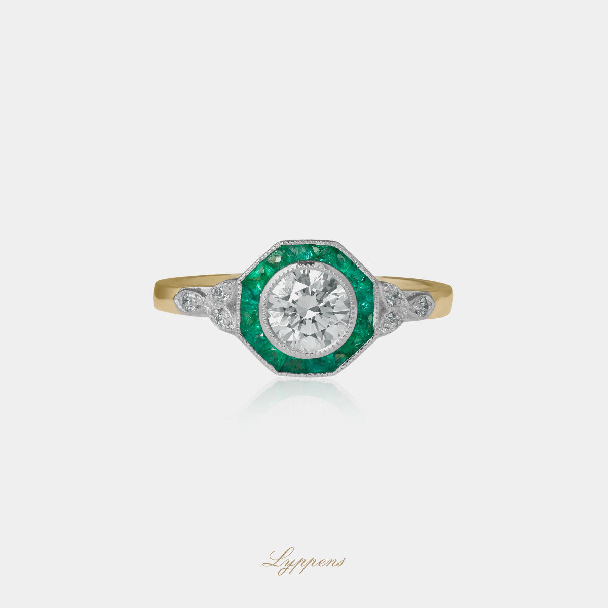 Yellow and white gold ring with emerald and diamonds