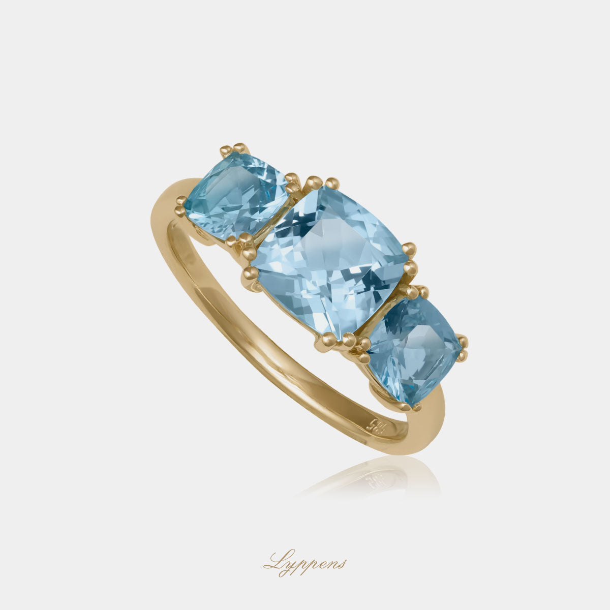Yellow gold three stone ring with topaz