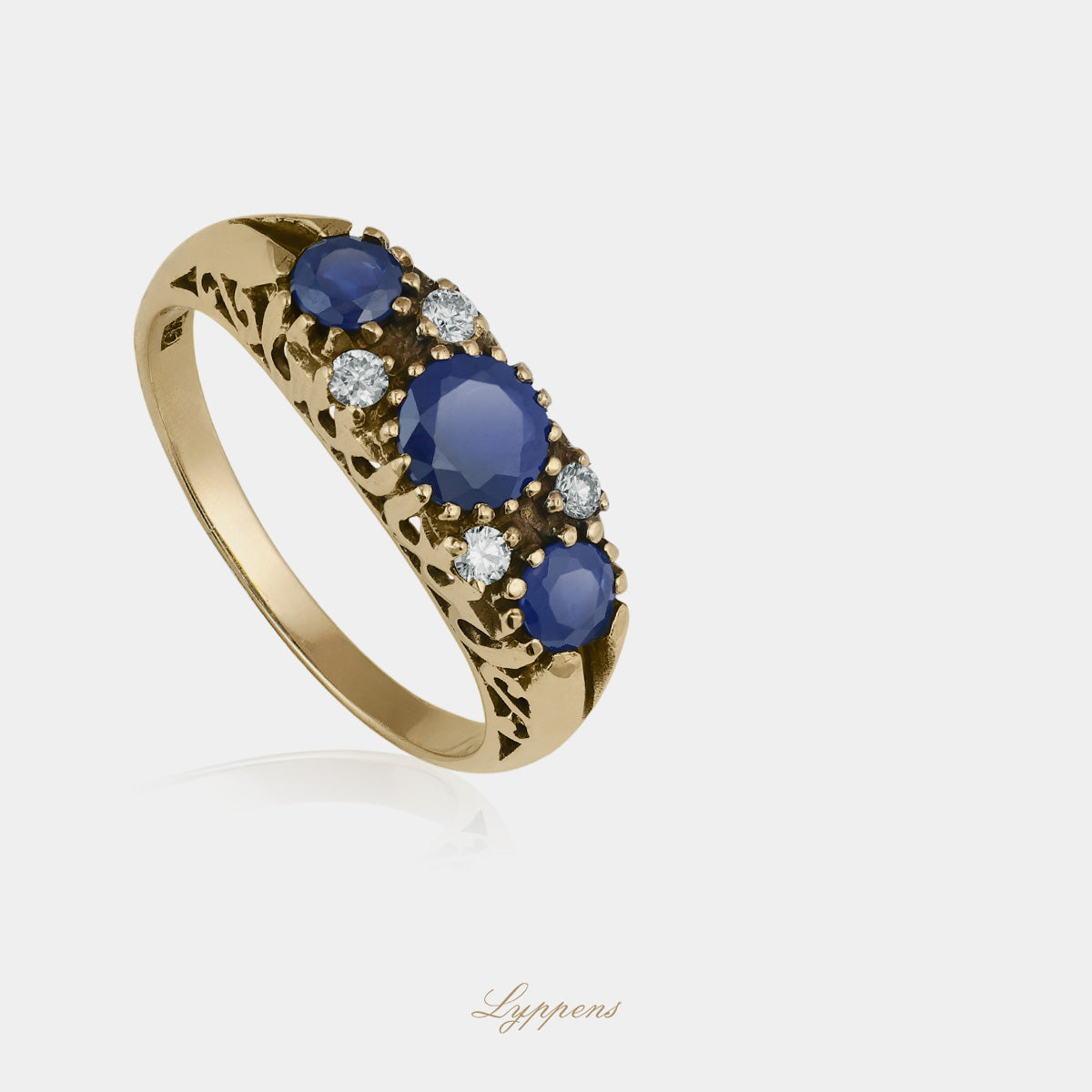 Yellow gold ring with sapphire and diamonds