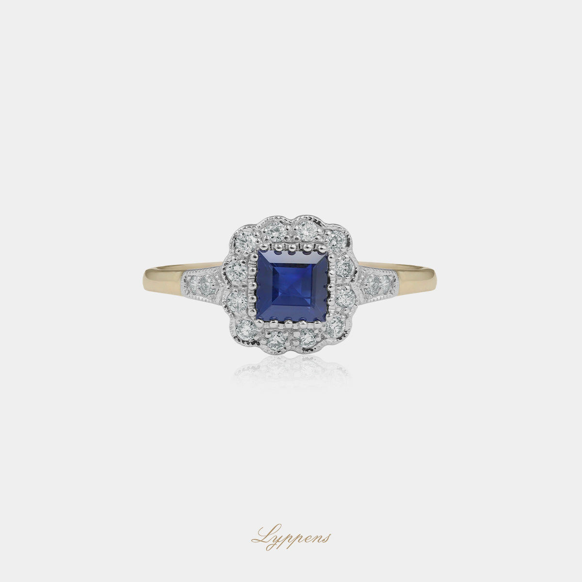 Geel- met witgouden ring met saffier en diamant