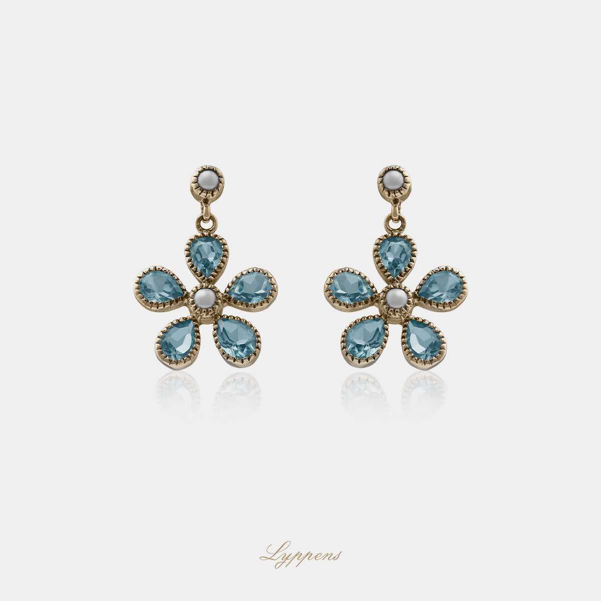 Geelgouden oorbellen met topaas en parel