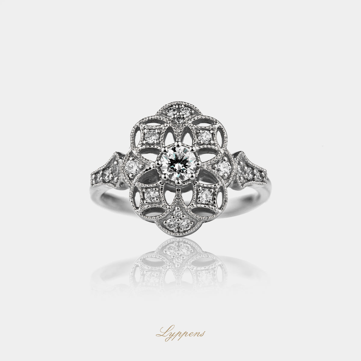 18kt witgouden ring met briljant geslepen diamant 0.20 ct G SI, omringd door kleine briljant geslepen diamanten, totaal 0.51 ct