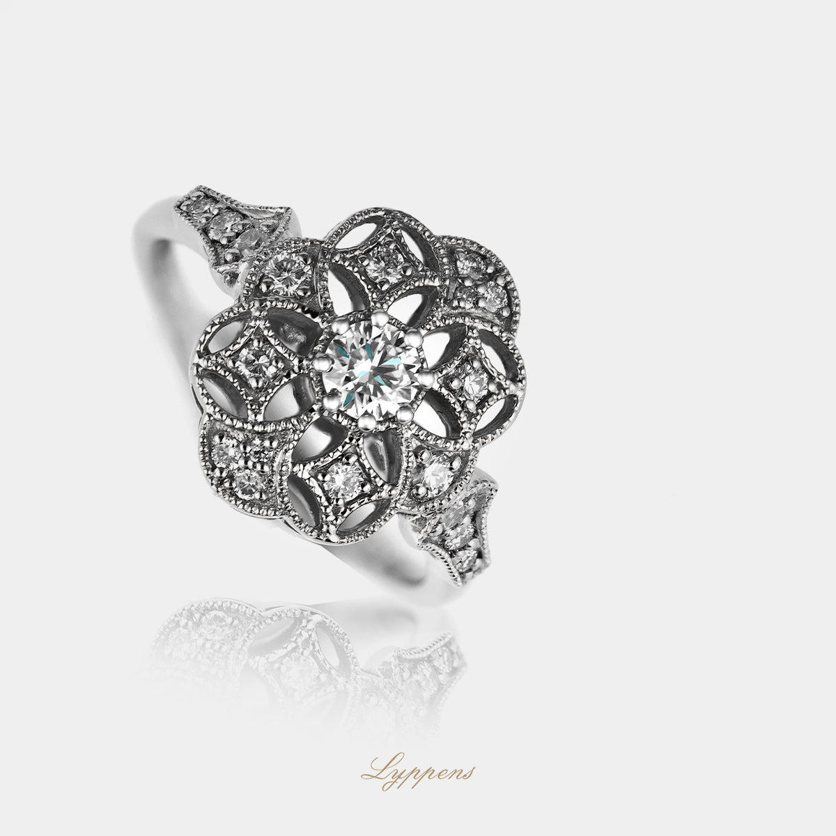 Witgouden ring met centrale diamant en briljant geslepen entourage