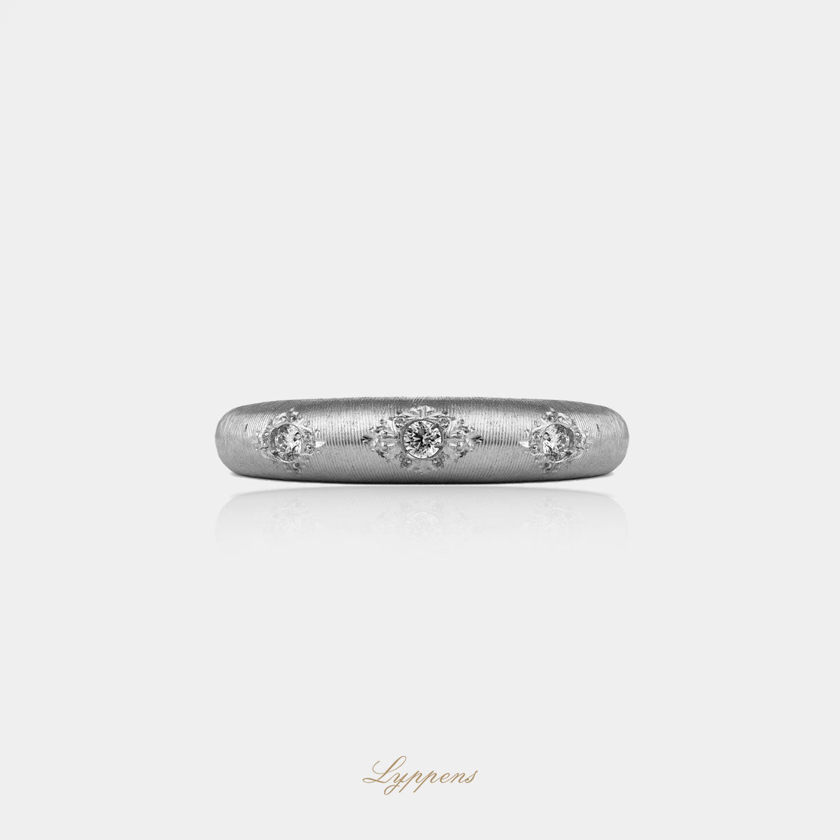 White gold three-stone ring with diamonds