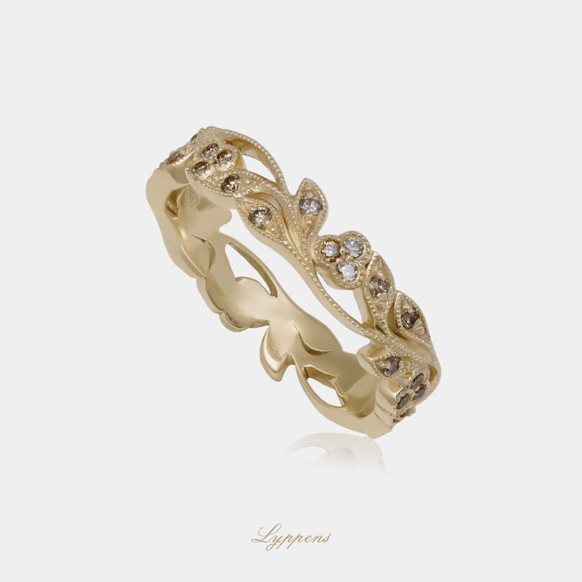 Yellow gold eternity ring with brown diamonds