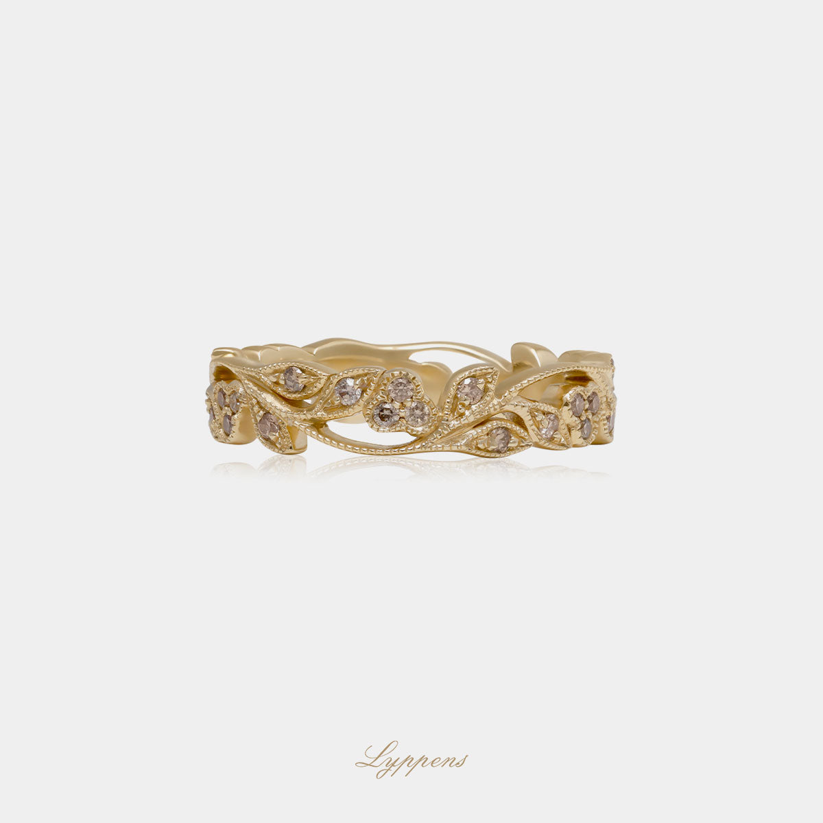 Yellow gold eternity ring with brown diamonds