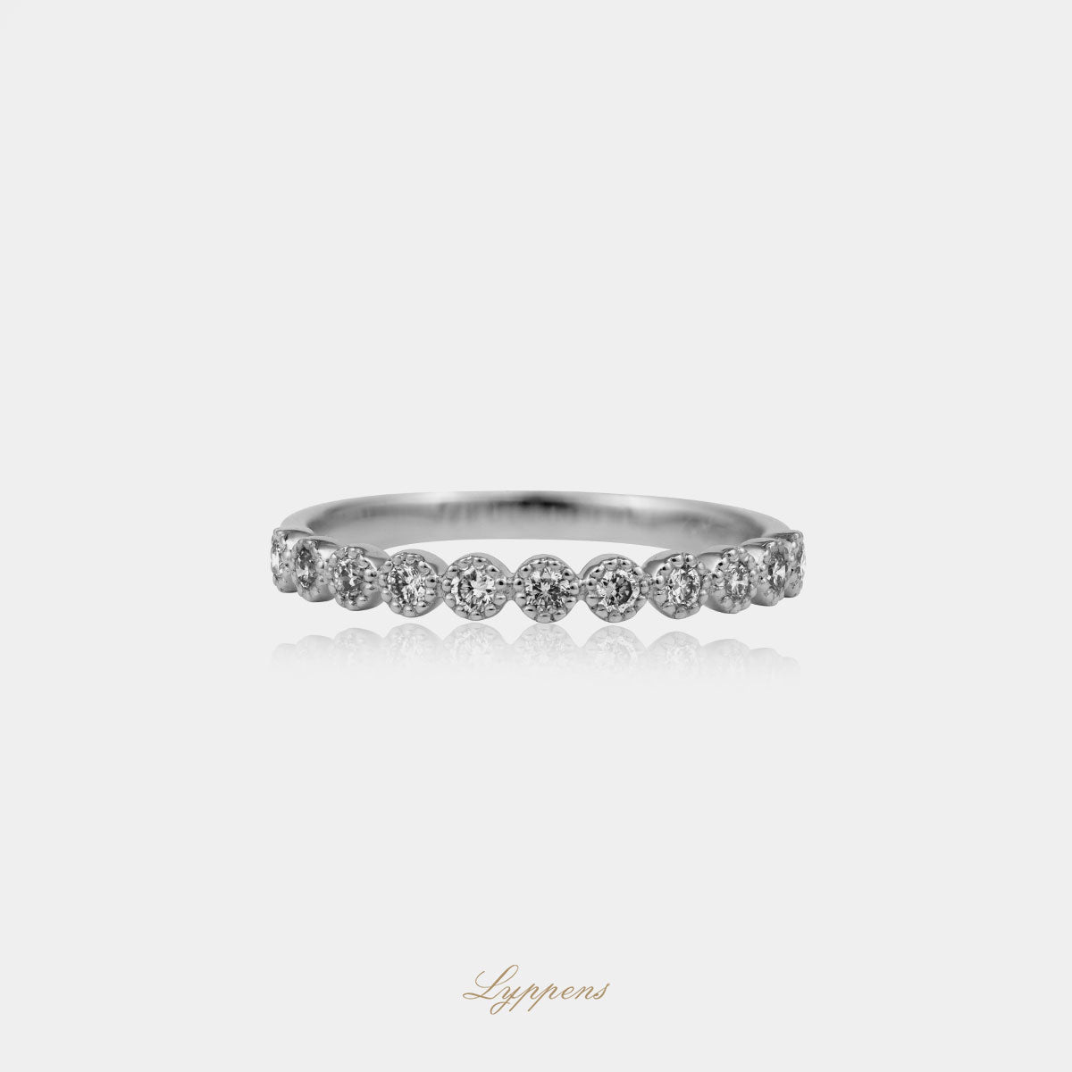 White gold half eternity ring with diamond
