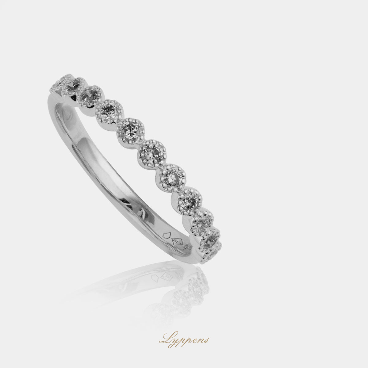 White gold half eternity ring with diamond