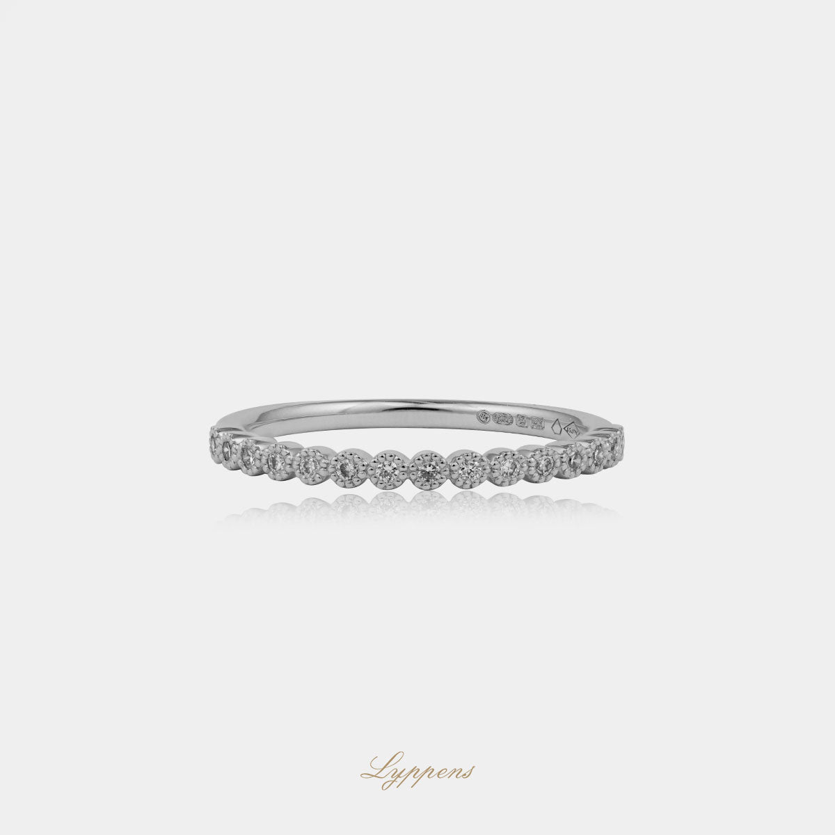 White gold half eternity ring with diamond