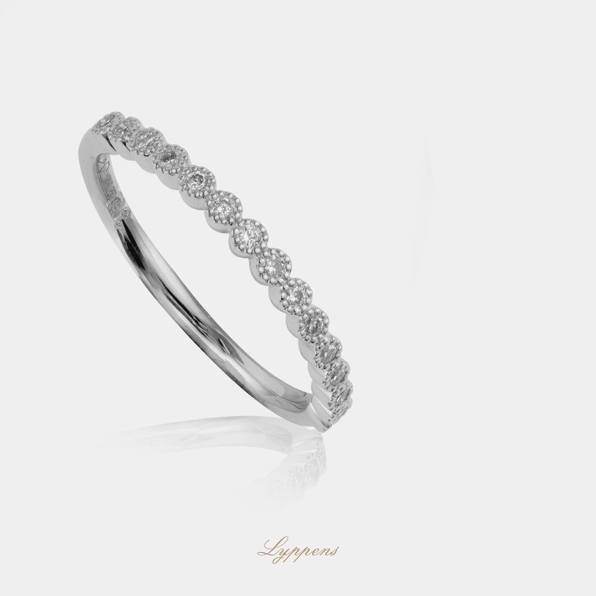 White gold half eternity ring with diamond