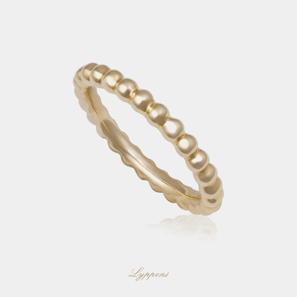 Geelgouden bolletjes ring met een breedte van 2.7mm.
