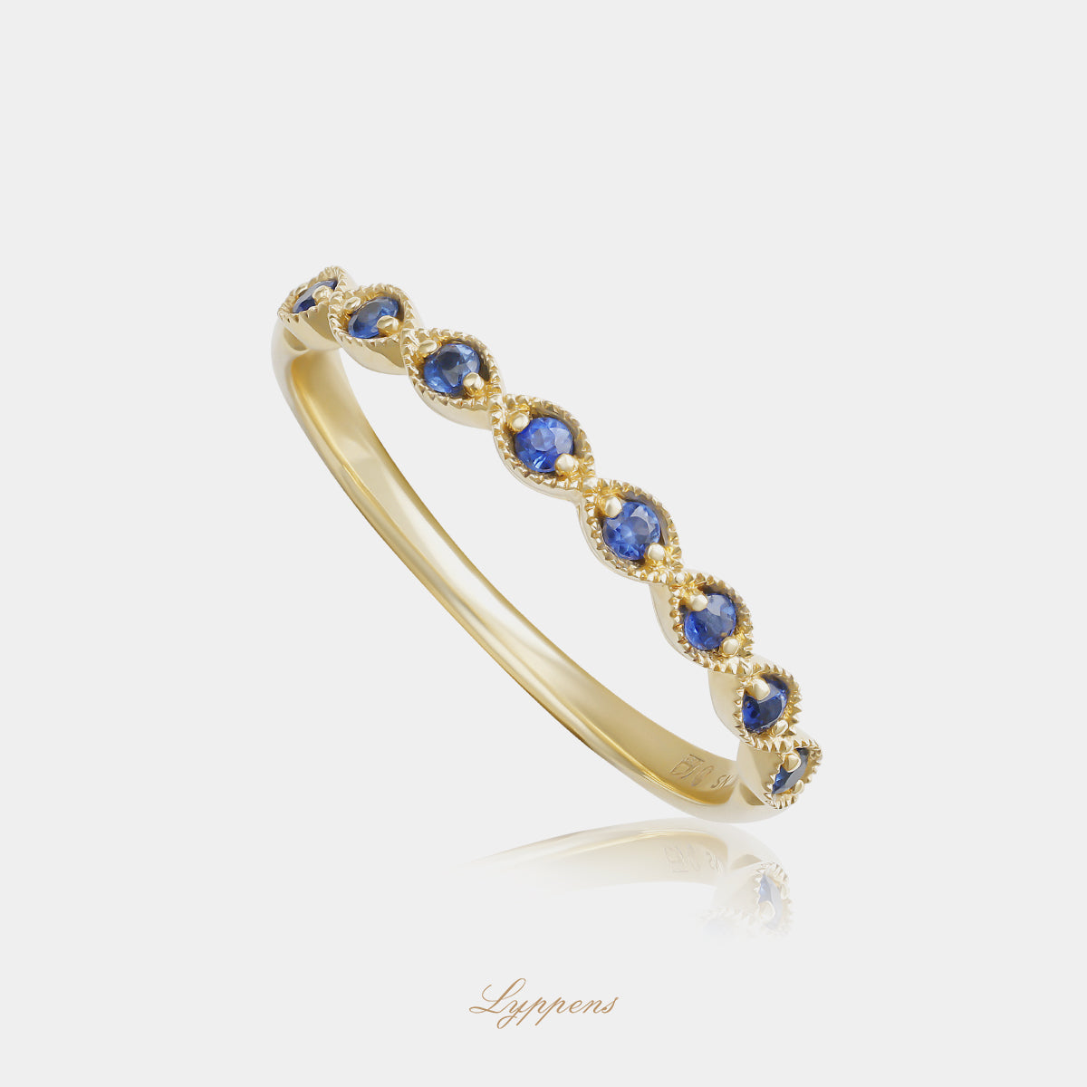 Yellow gold half eternity ring with sapphires