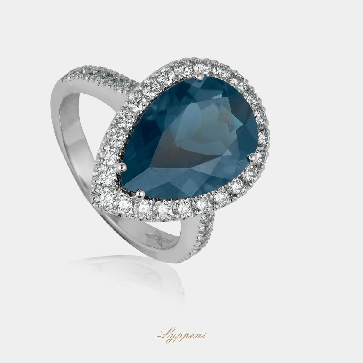 White gold entourage ring with topaz and diamonds