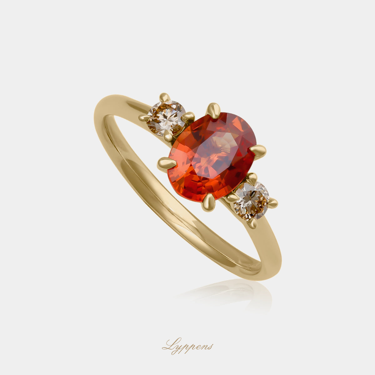 18kt geelgouden verlovingsring met oranje saffier en bruine diamanten zijstenen