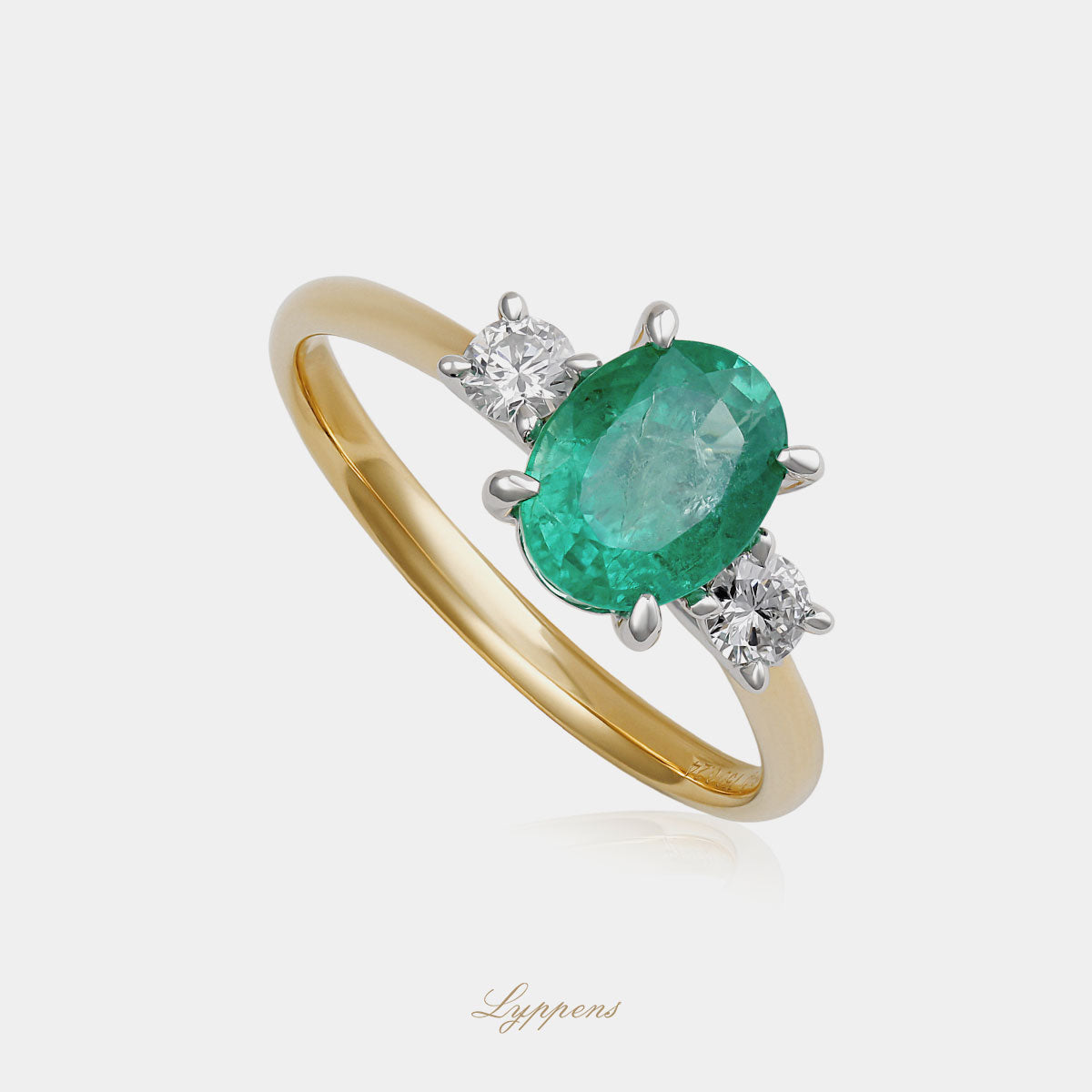 bicolor 18kt verlovingsring met smaragd en briljant geslepen diamanten zijstenen