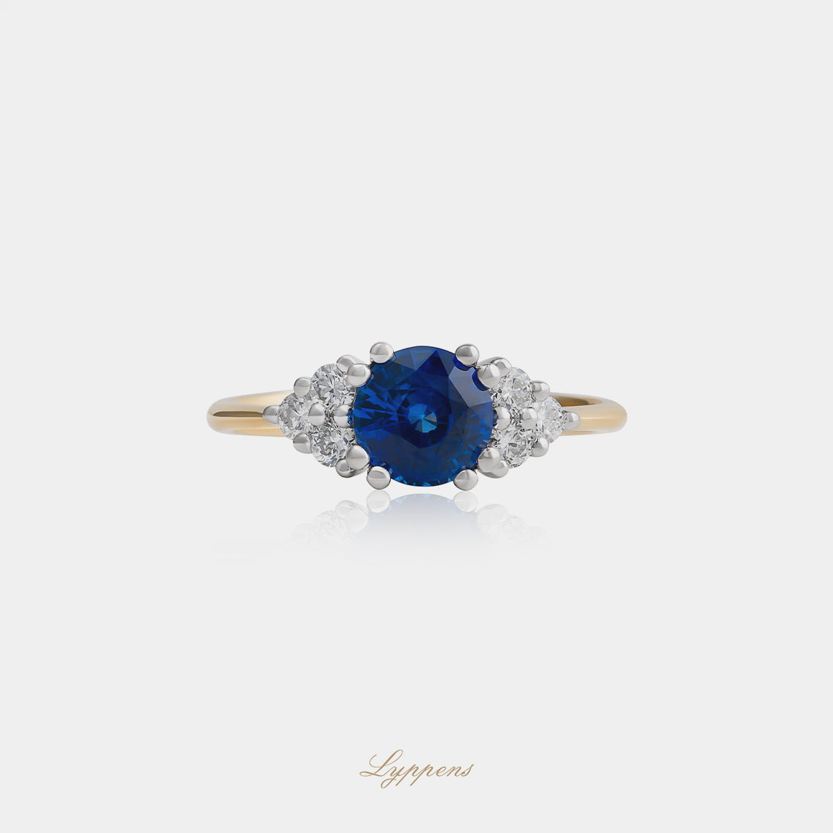 18kt geel- en witgouden ring met rond saffier en briljant diamant 0.28ct G SI1