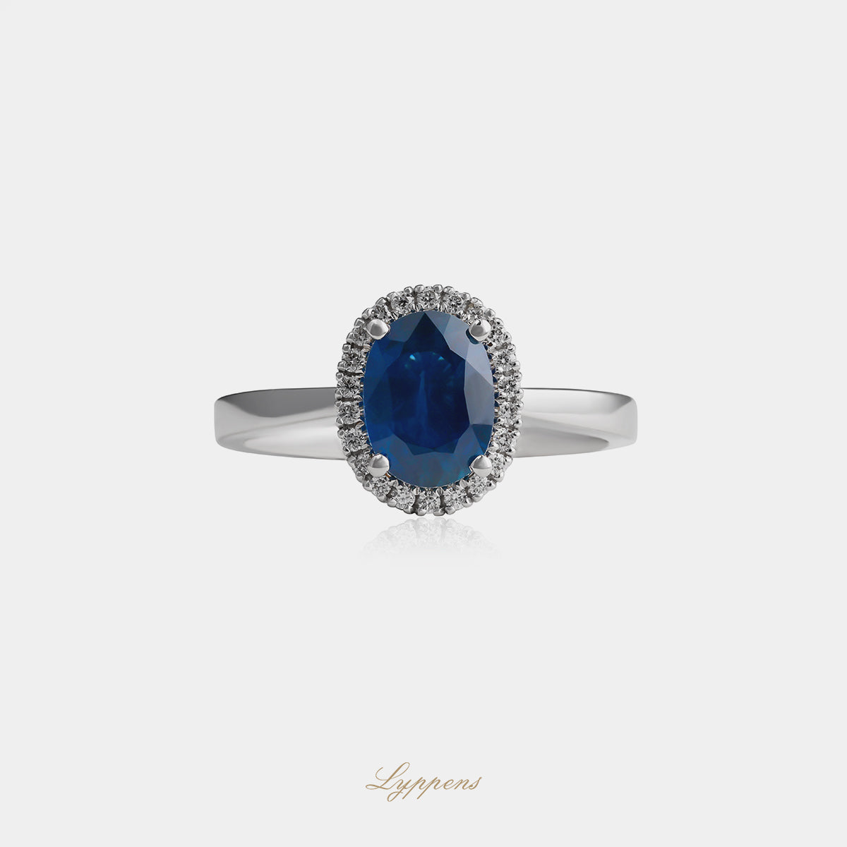 White gold halo ring with sapphire and diamonds