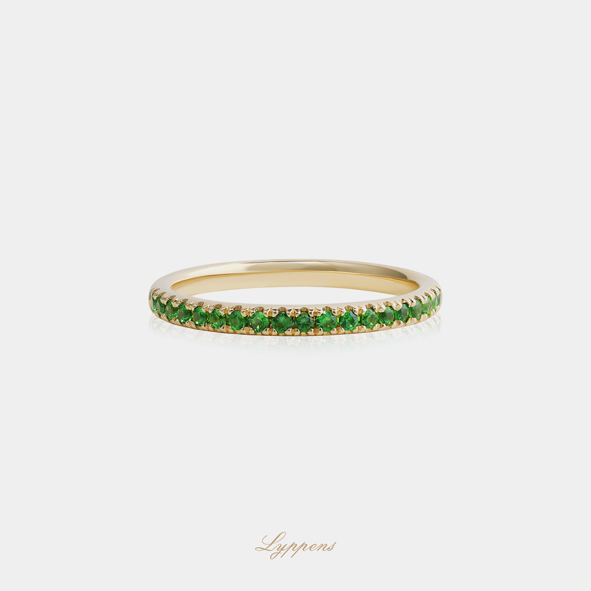 Yellow gold half eternity ring with tsavorite