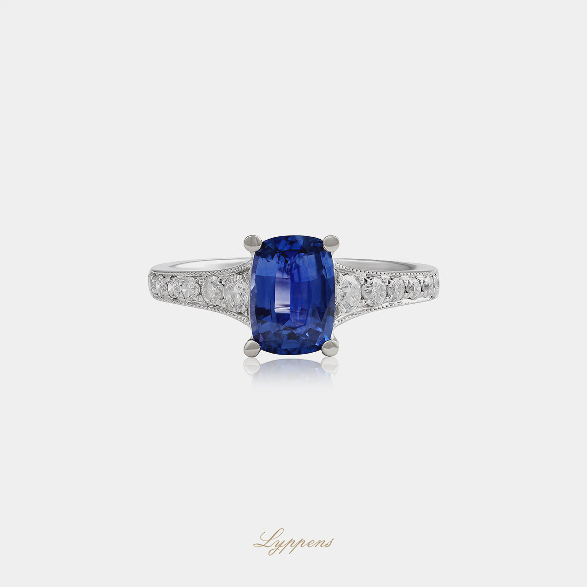 White gold ring with sapphire and diamonds