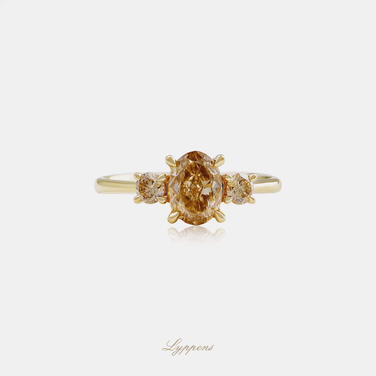 Yellow gold three-stone ring with brown diamonds