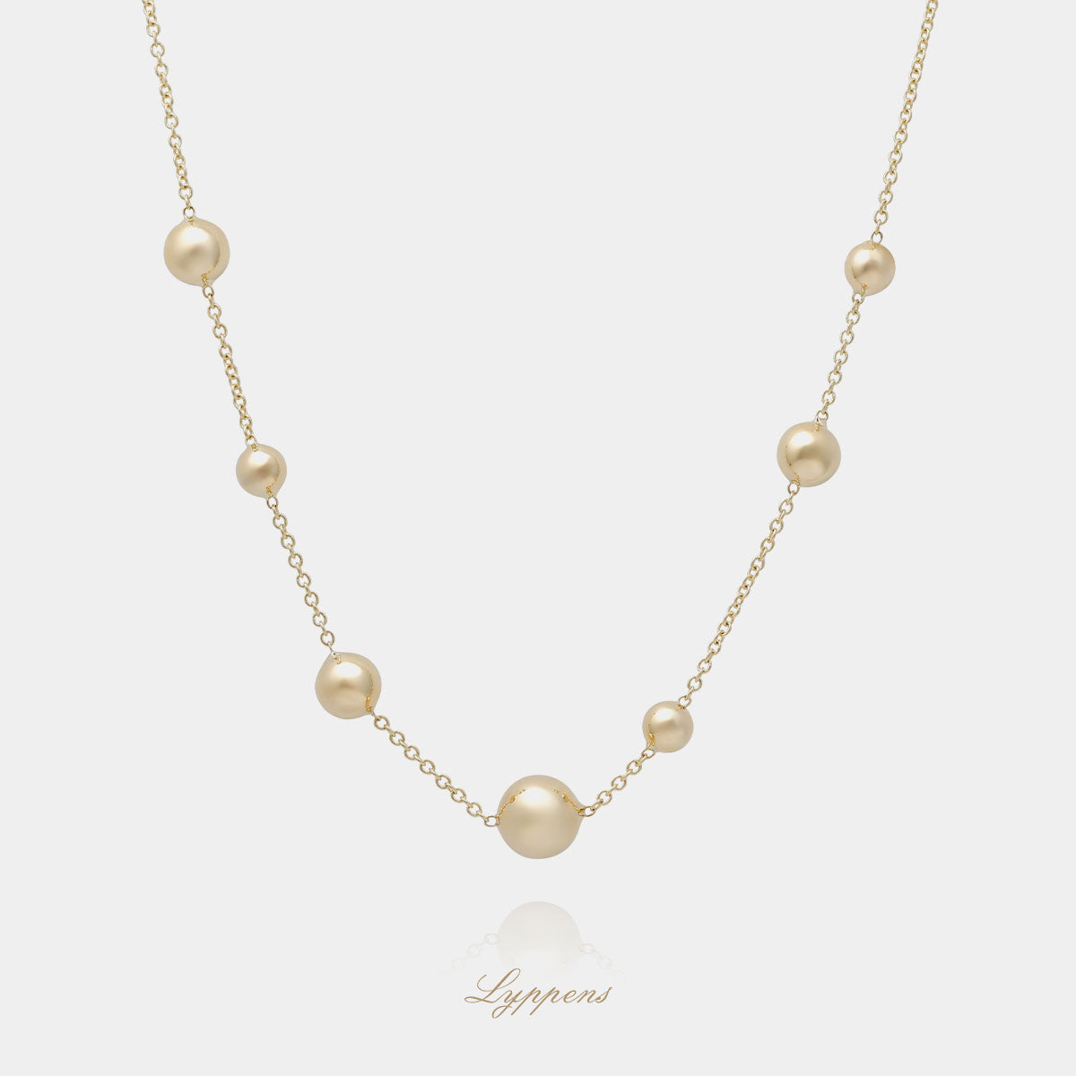 Yellow gold necklace with spheres