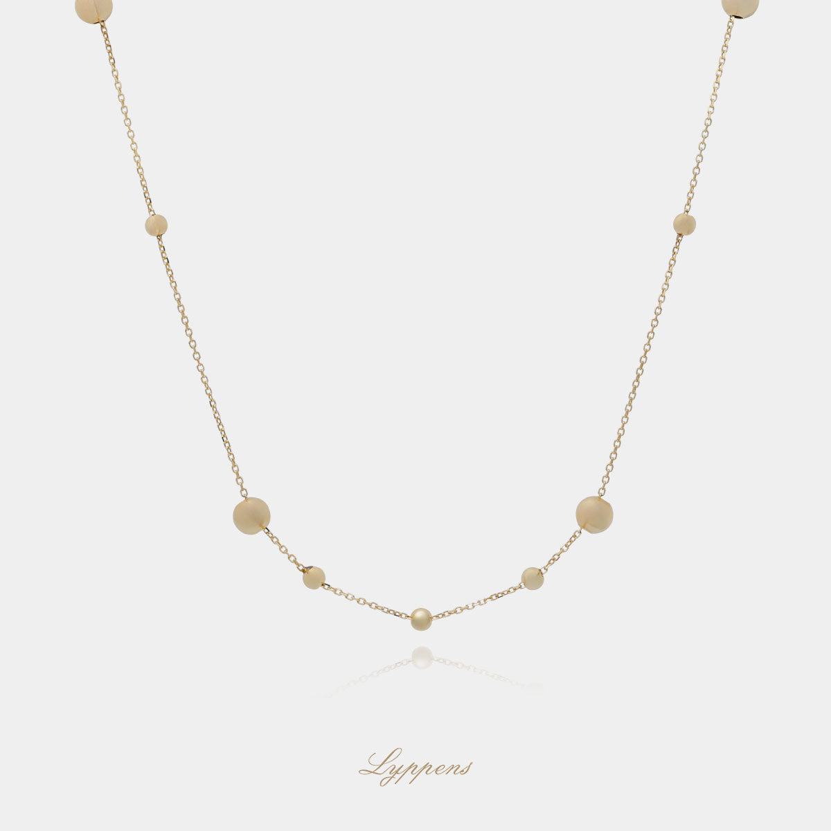 Geelgouden collier met balletjes