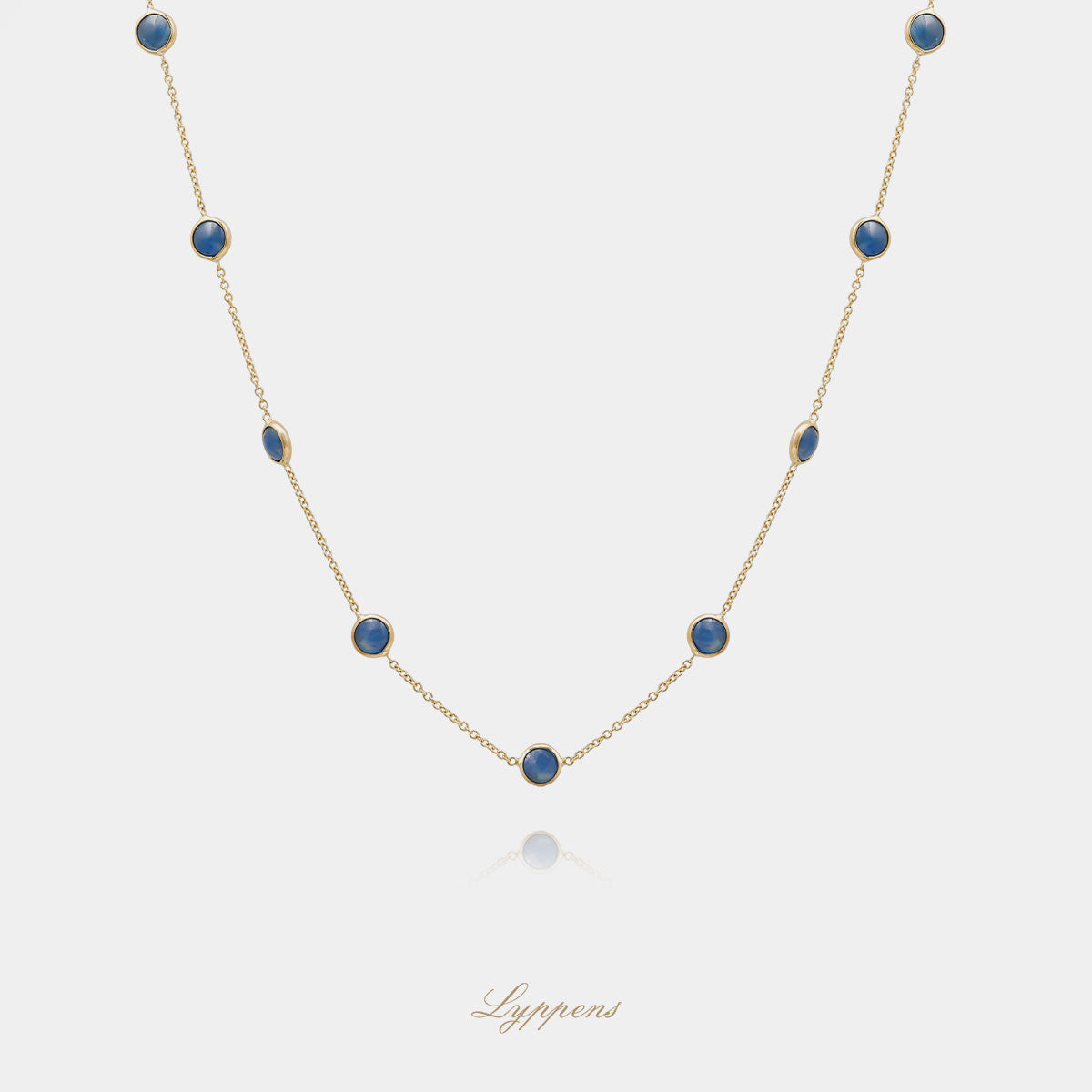 Yellow gold necklace with sapphire