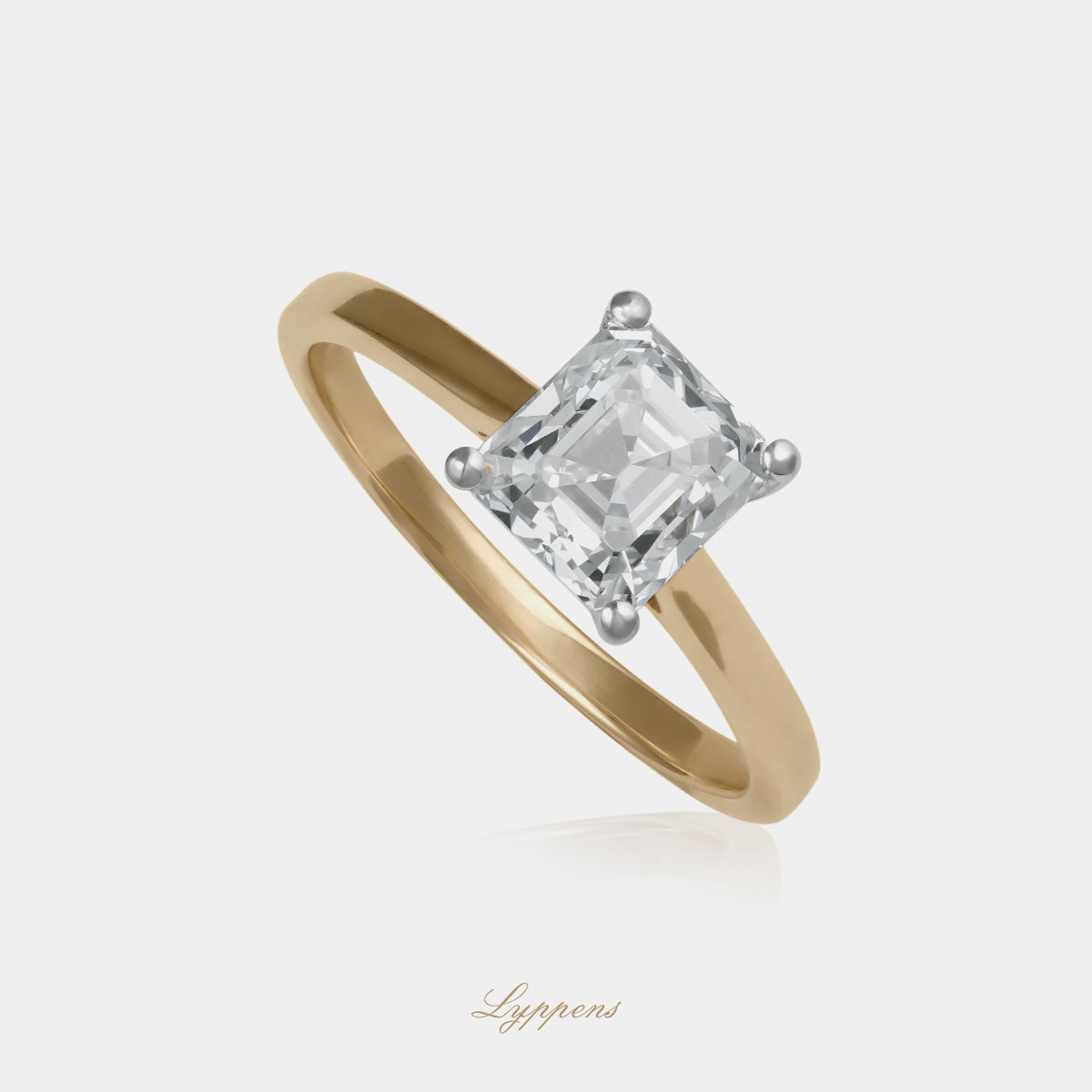 Geel- en witgouden solitair ring met emerald geslepen diamant