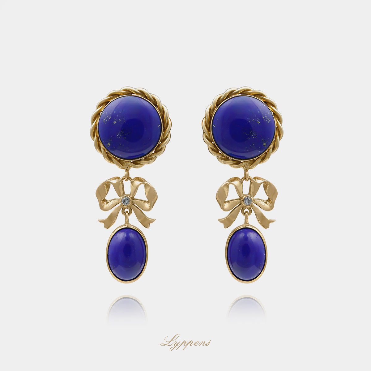 Geelgouden vintage jaren ‘70 ‘day and night’ oorbellen met lapis lazuli en diamant