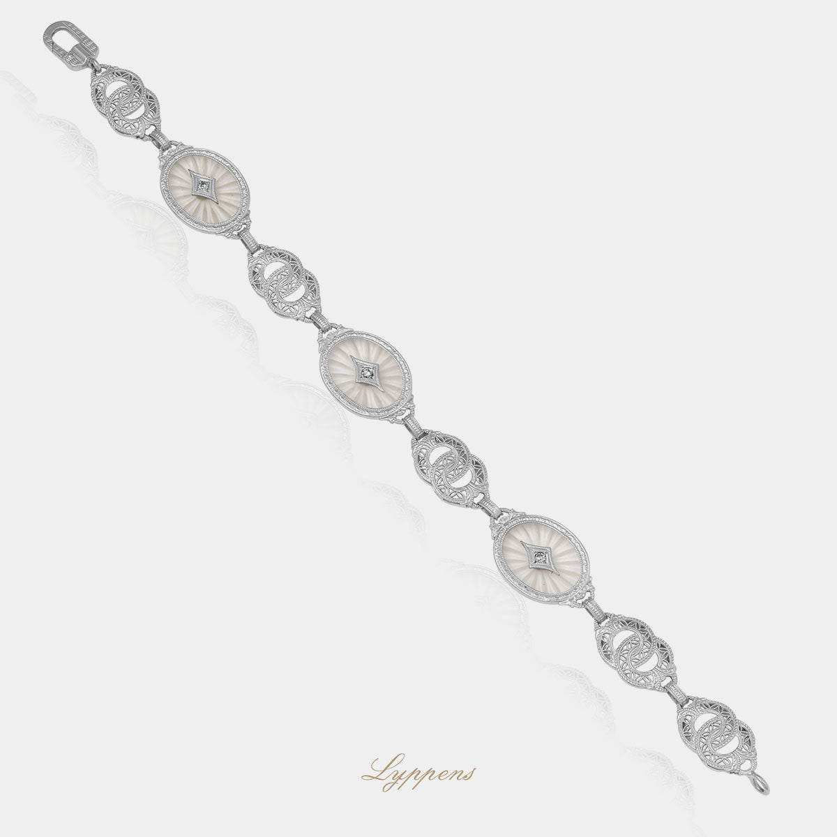 Witgouden vintage armband met bergkwarts en achtkant geslepen diamant.