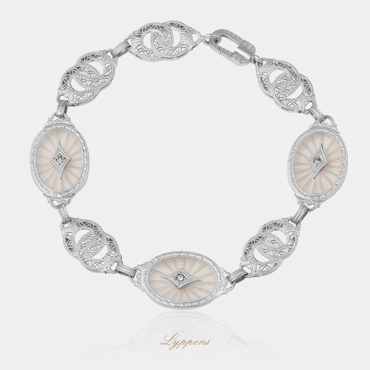 Witgouden vintage armband met bergkwarts en achtkant geslepen diamant.