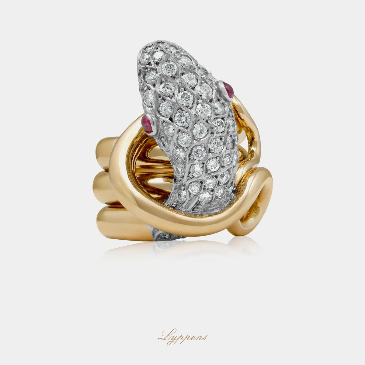 Geelgouden vintage slangen ring met briljant geslepen diamant en robijn.