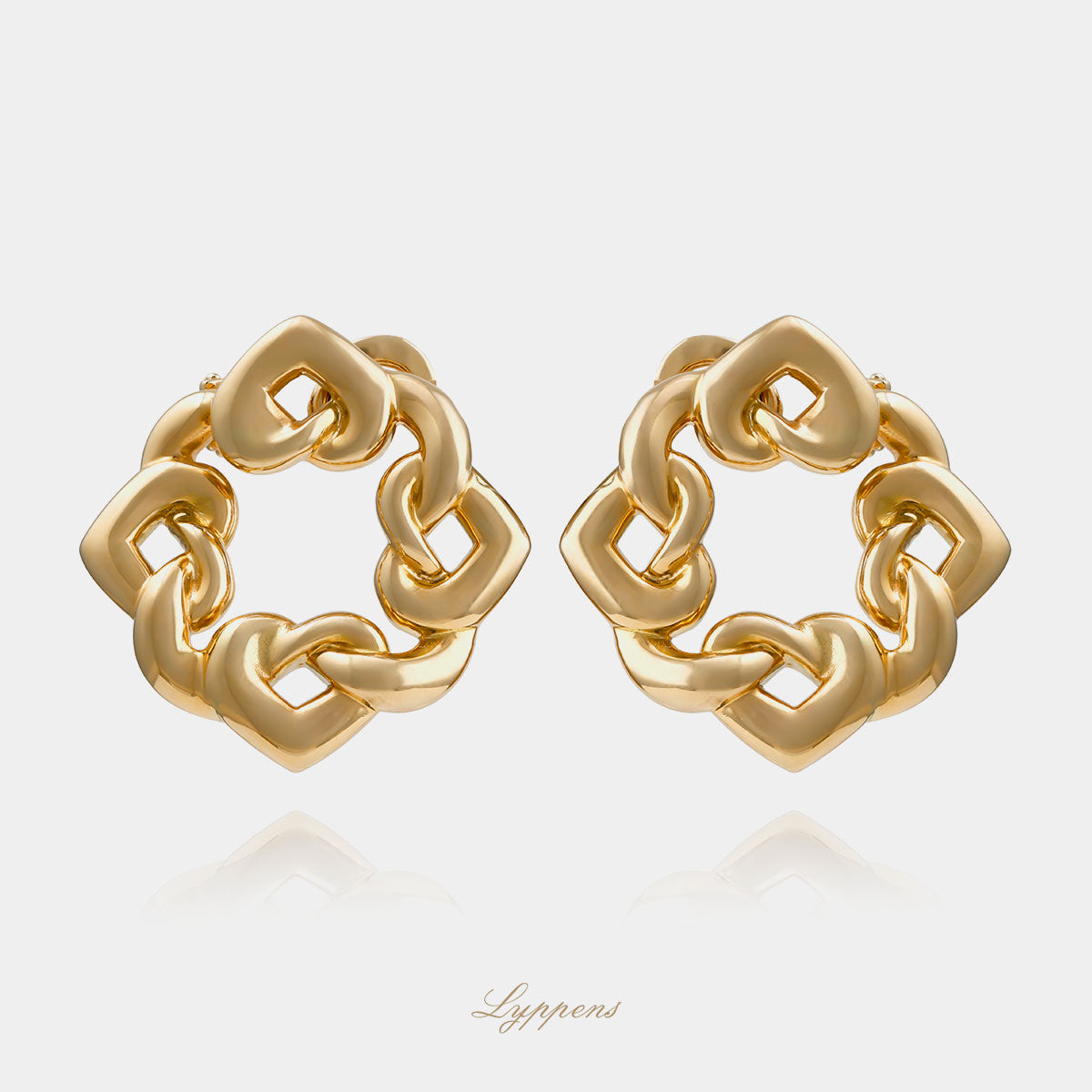 14kt geelgouden vintage oorclips in de vorm van gevlochten hartjes