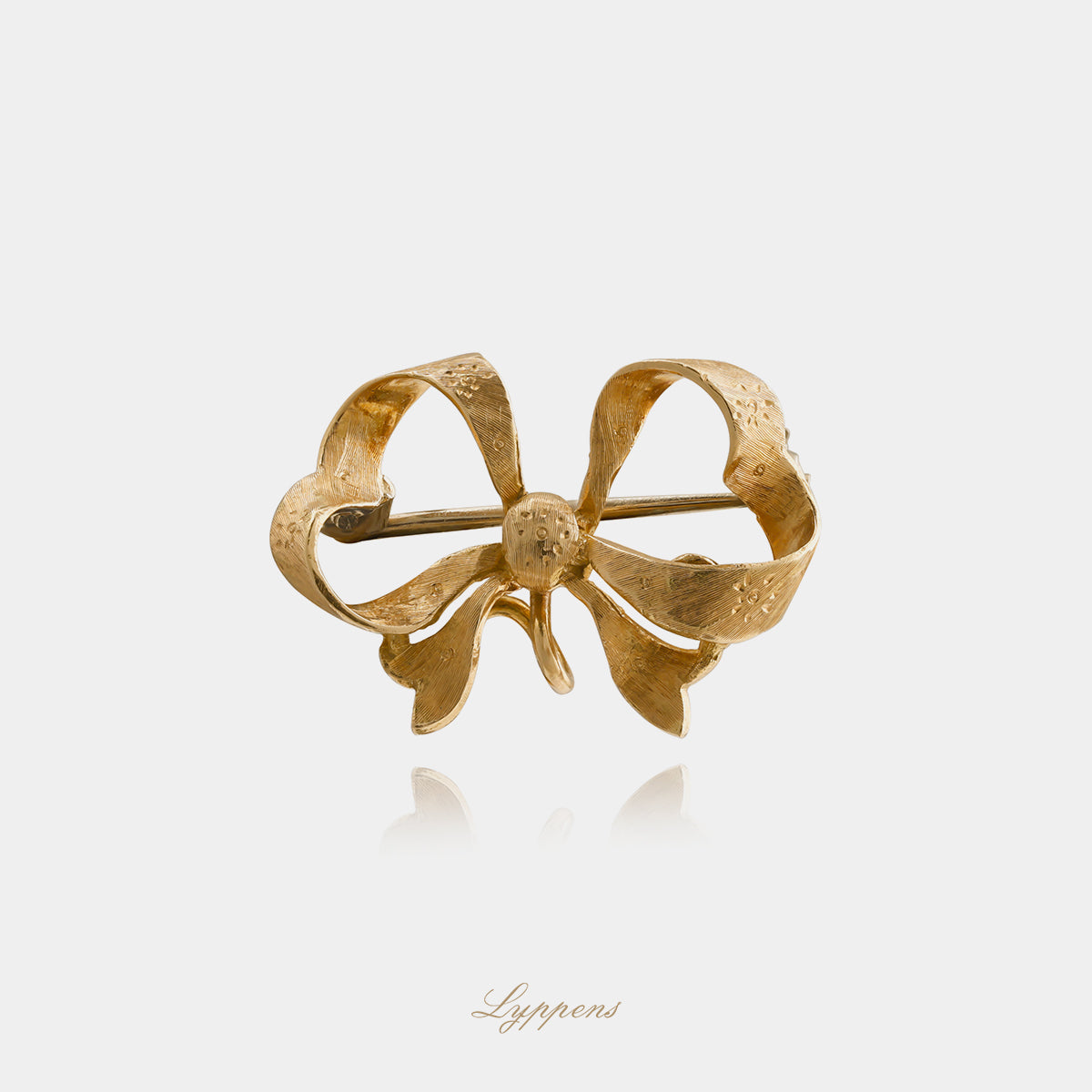Yellow gold vintage bow brooch