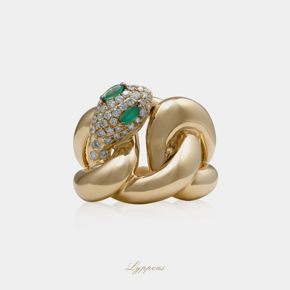 Yellow gold vintage snake ring with emerald and diamonds