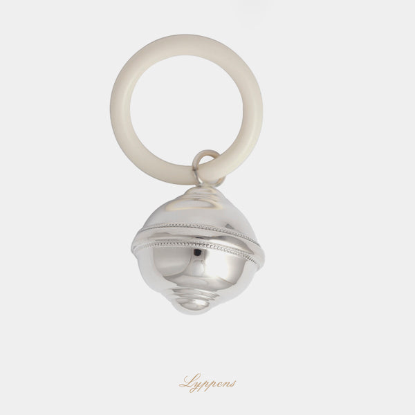 Eerste gehalte zilveren rammelaar in de vorm van een tol gedecoreerd met een parelrand.