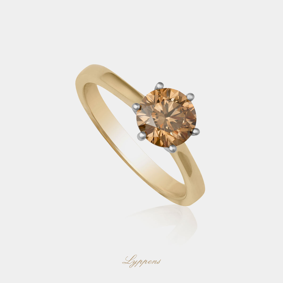 Yellow gold solitaire ring with brown diamond