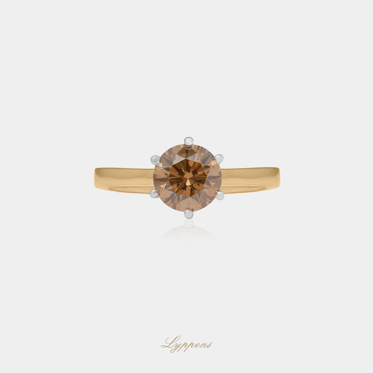 Yellow gold solitaire ring with brown diamond