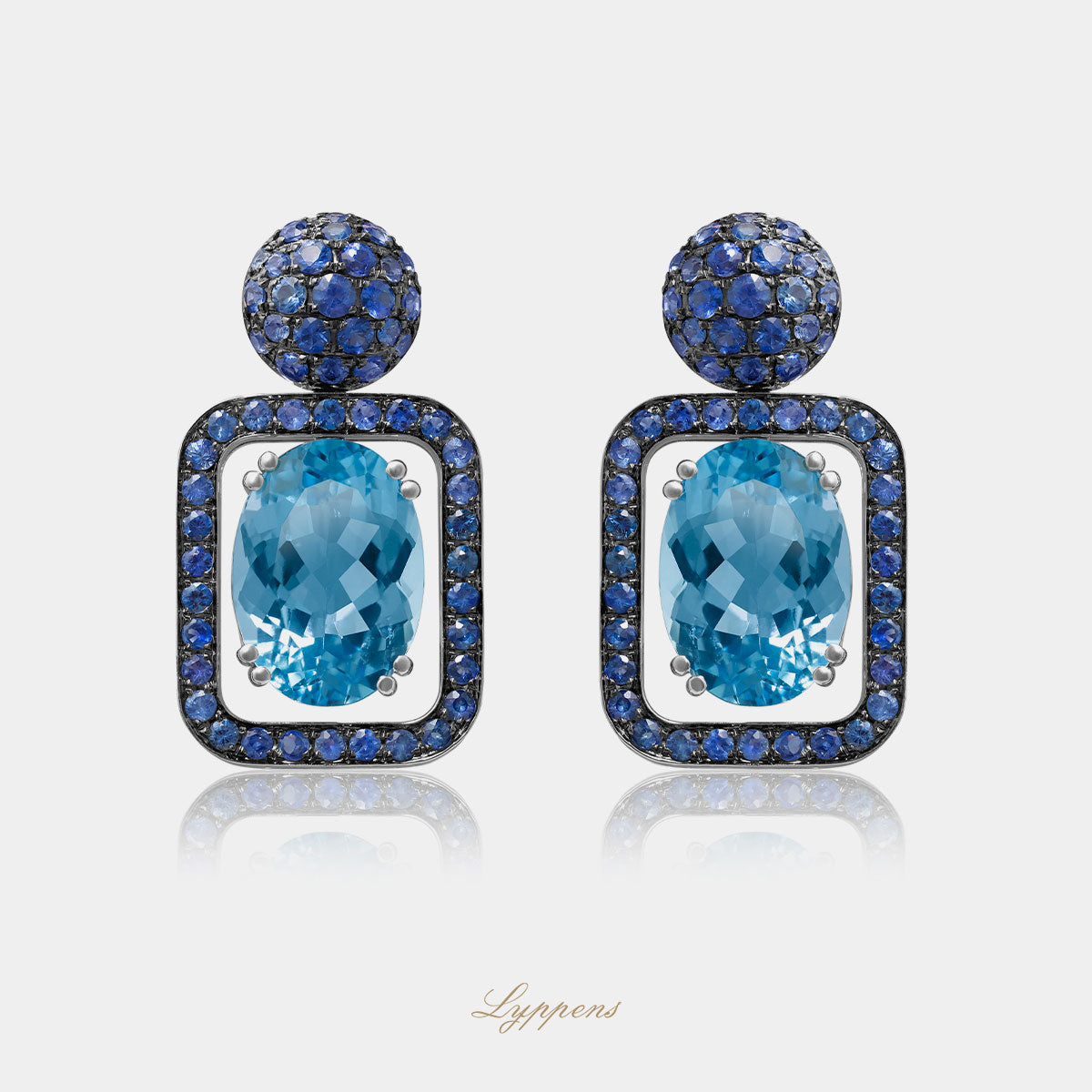 White gold earrings with topaz and sapphire