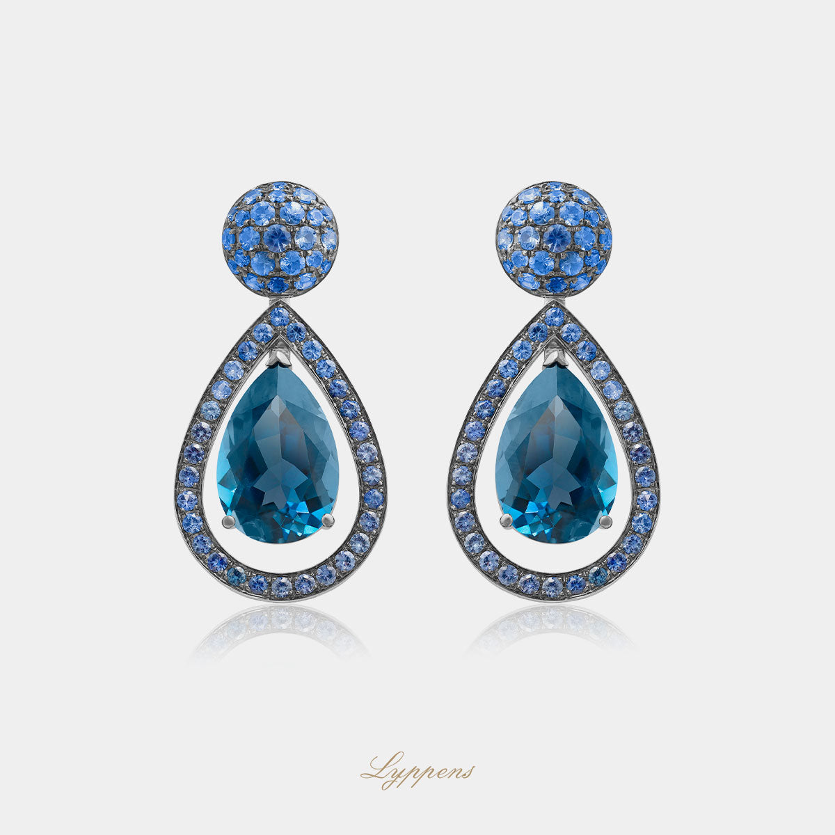 White gold earrings with topaz and sapphire