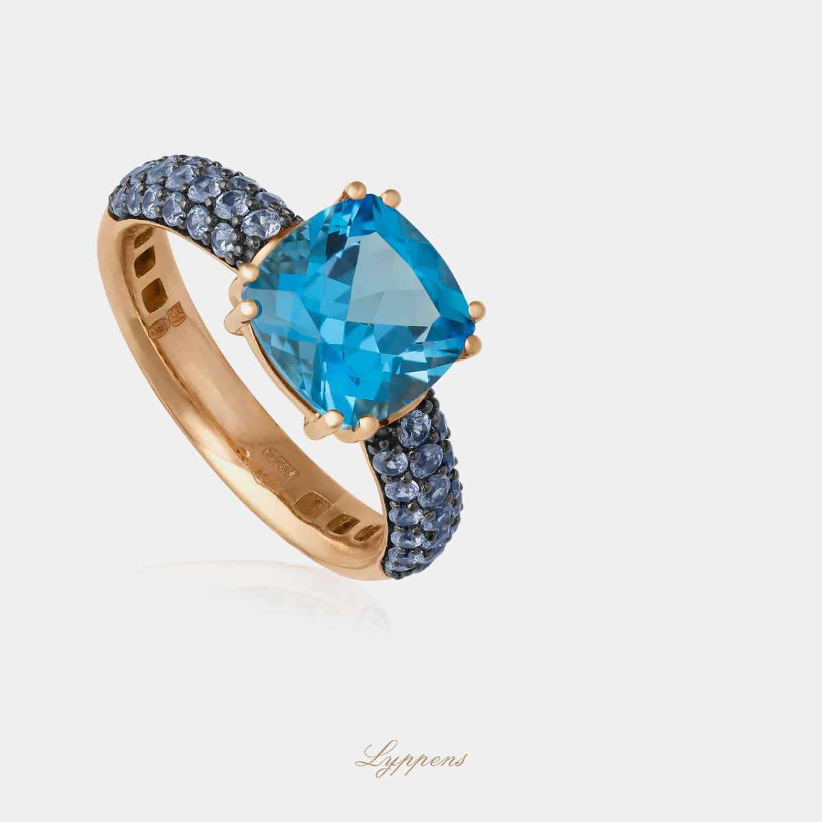 Rose gold ring with topaz and sapphire