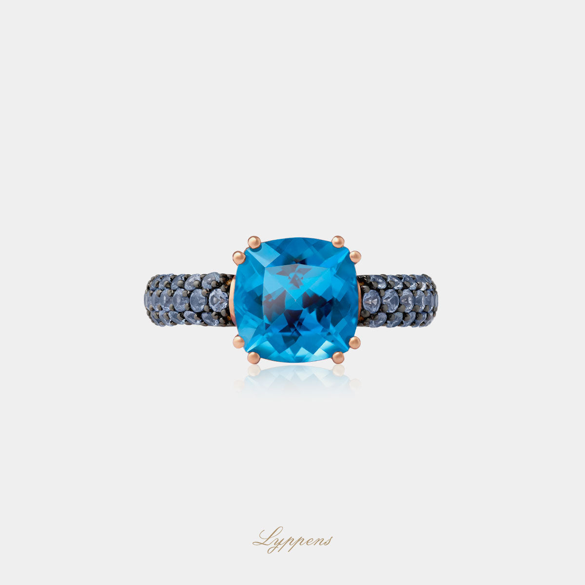 Rose gold ring with topaz and sapphire