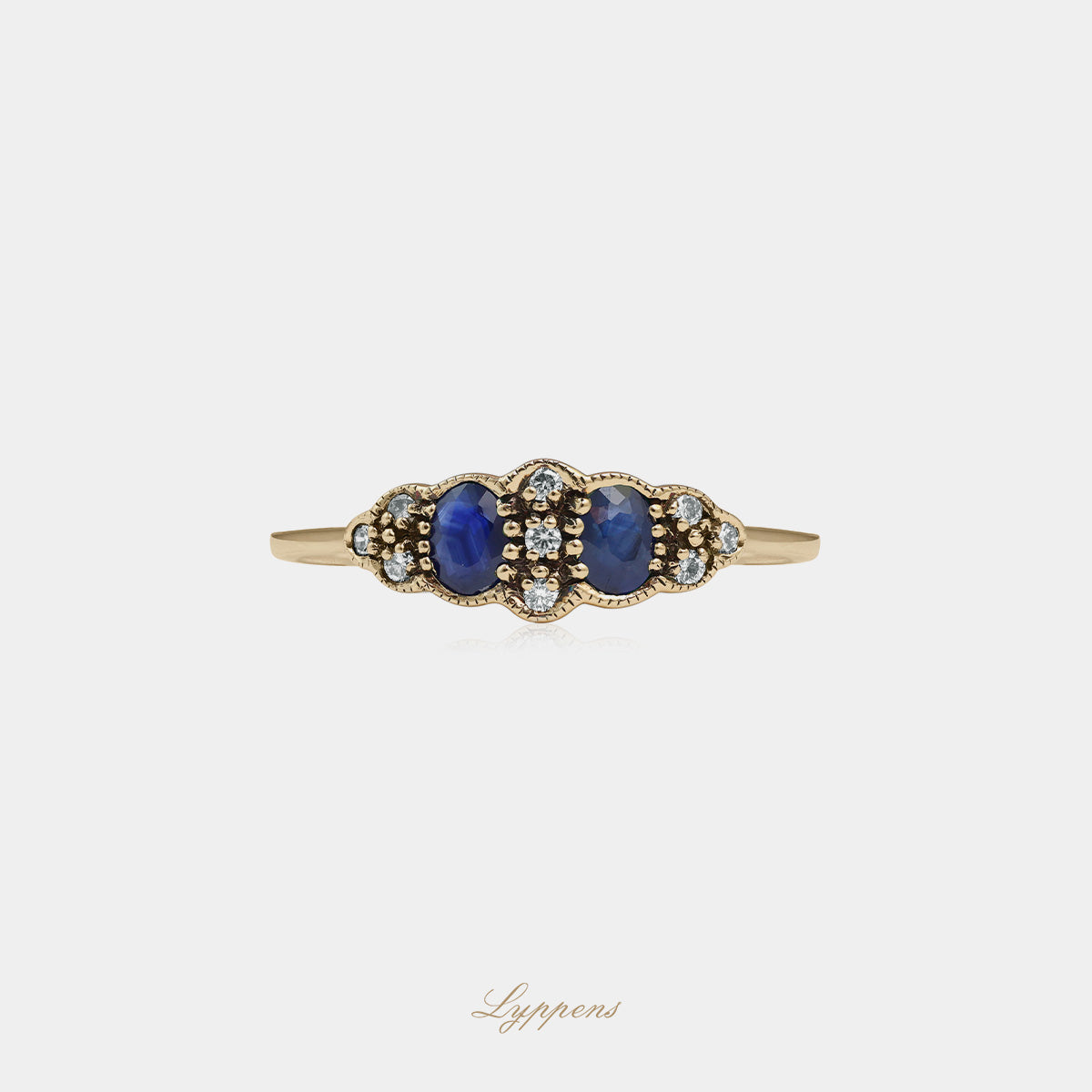 Yellow gold ring with sapphire and diamonds