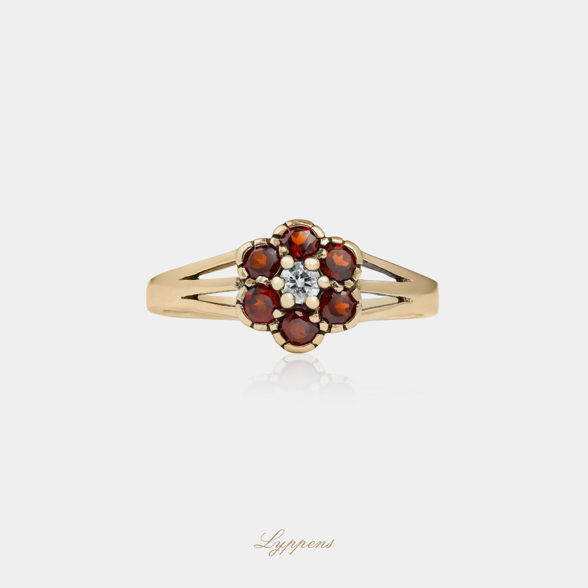 Yellow gold ring with diamond and garnets