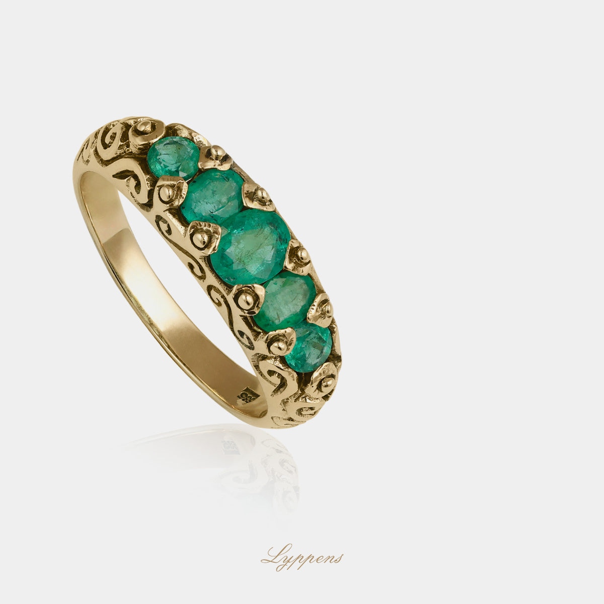 Yellow gold five stone ring with emerald