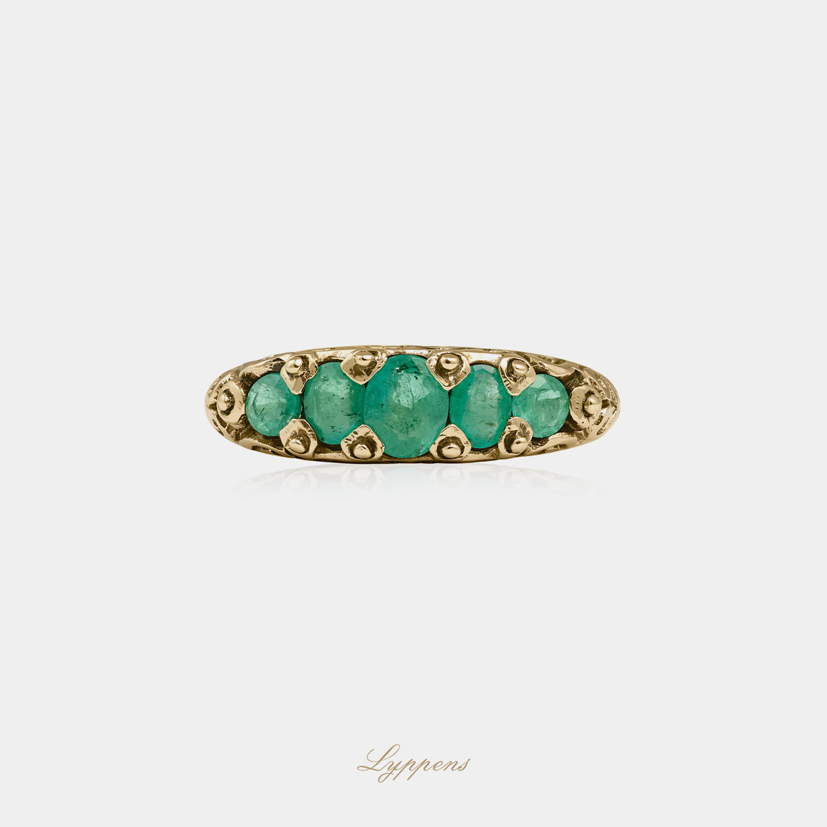 Yellow gold five stone ring with emerald