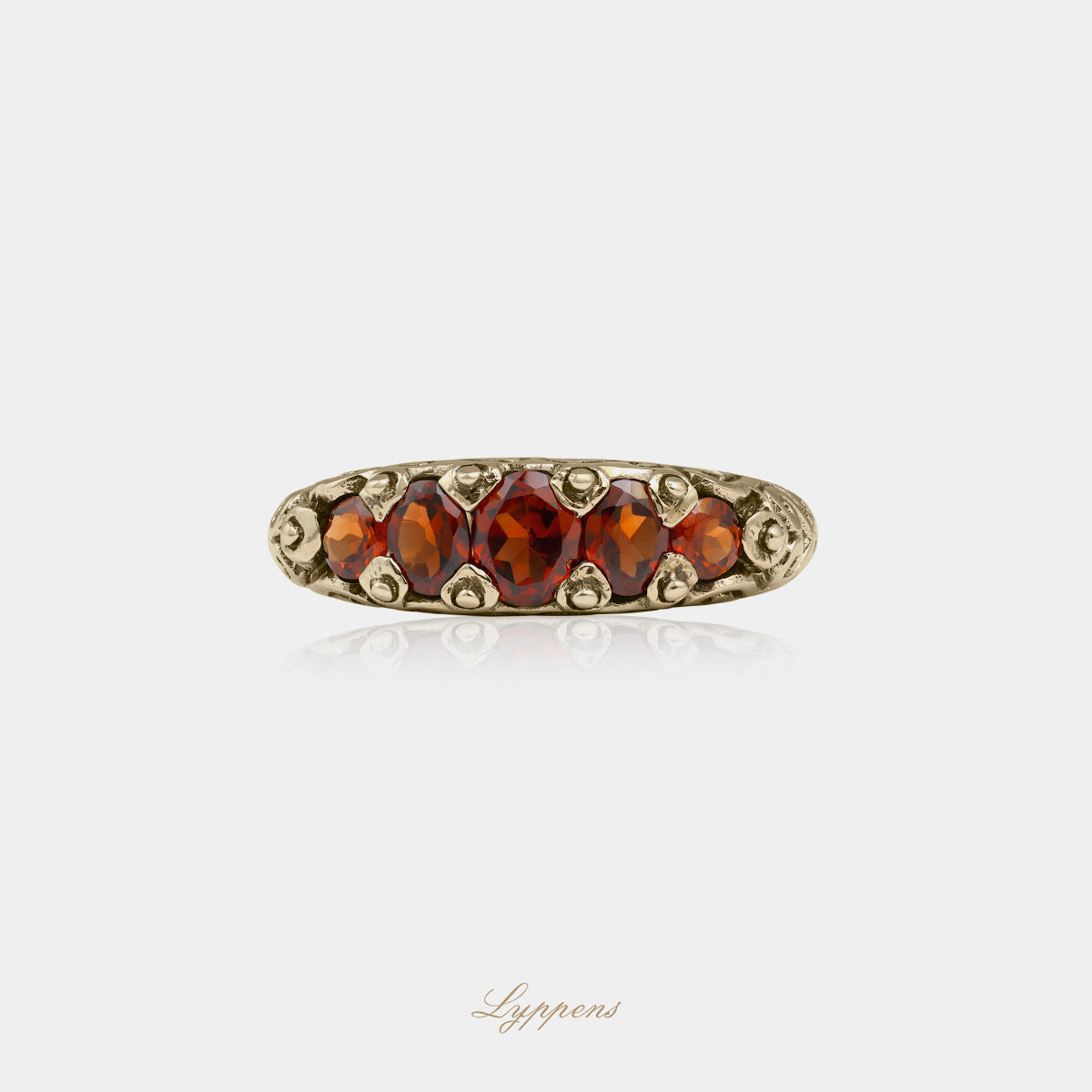 Yellow gold five stone ring with garnet