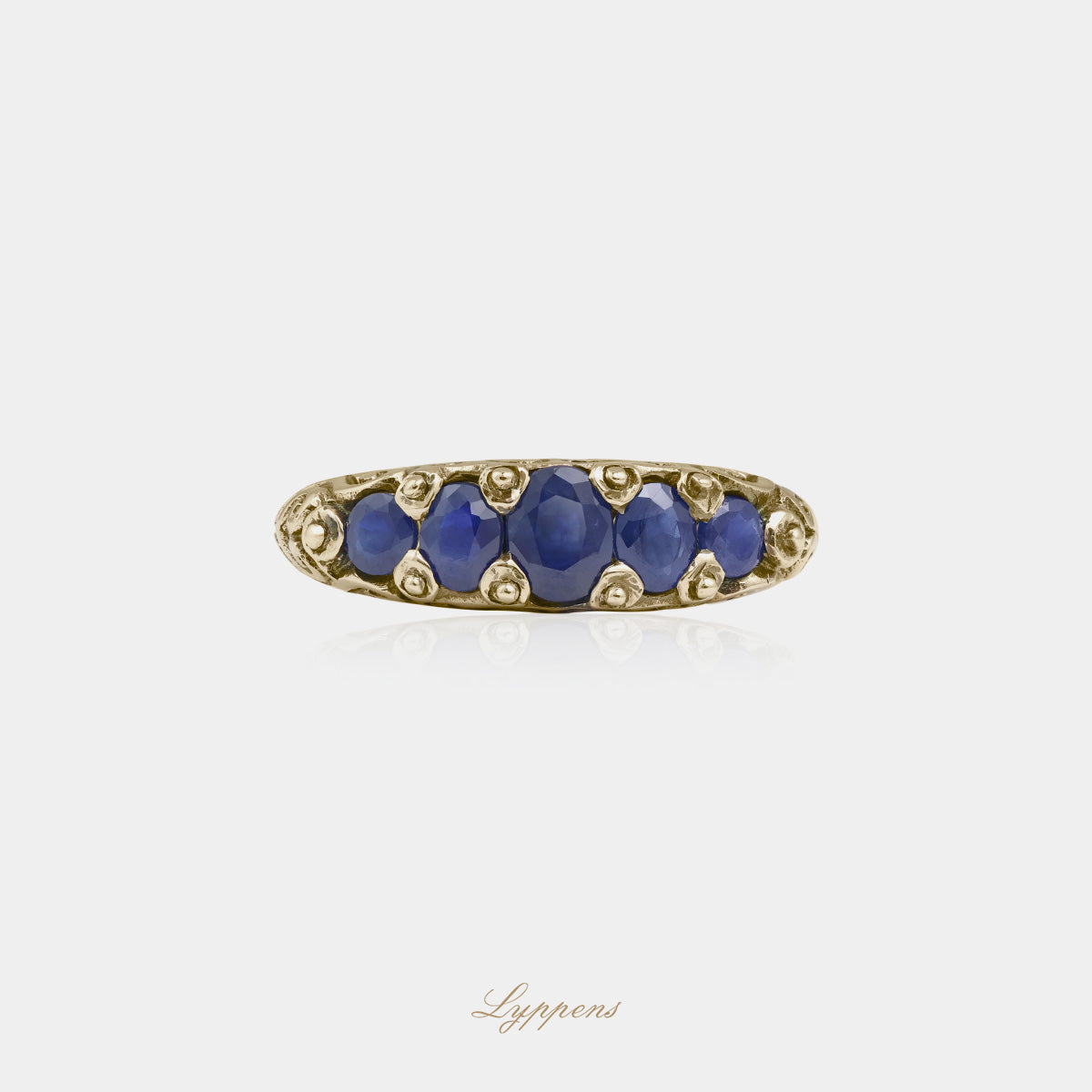 Yellow gold five stone ring with sapphire